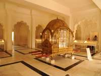 Asia, India - Ornate golden palanquin displayed in the City Palace Museum, Rajasthan. 