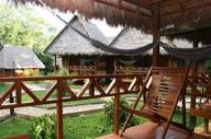 Relaxing hammock terrace overlooking jungle lodges in Tambopata, Peru. 