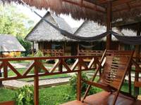 Relaxing hammock terrace overlooking jungle lodges in Tambopata, Peru. 