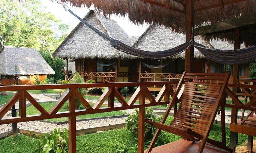 Relaxing hammock terrace overlooking jungle lodges in Tambopata, Peru. 