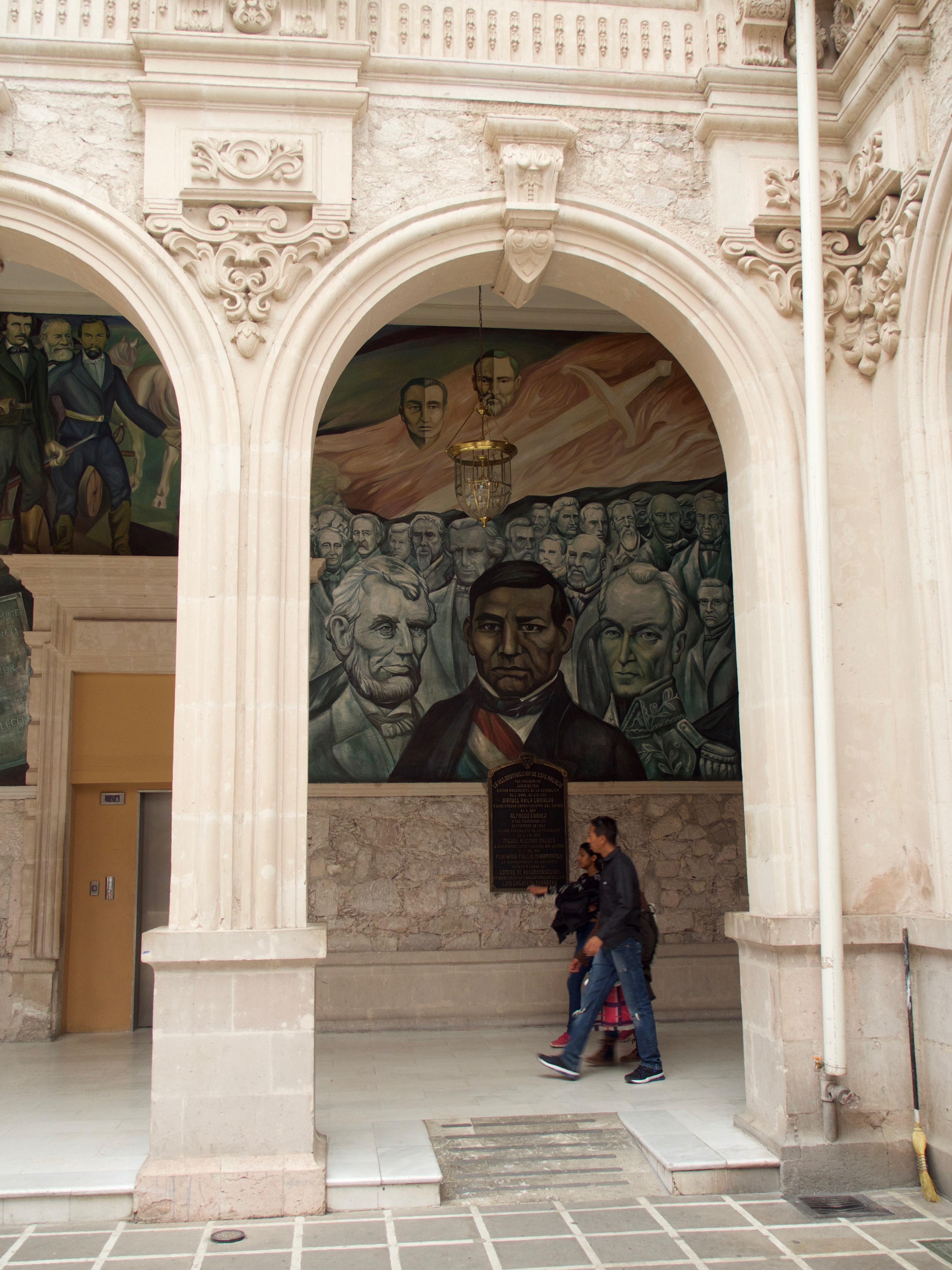 Historic mural at the Government Palace in Merida, Yucatan, Mexico, featuring portraits of key Mexican political figures. 