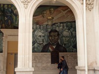 Historic mural at the Government Palace in Merida, Yucatan, Mexico, featuring portraits of key Mexican political figures. 