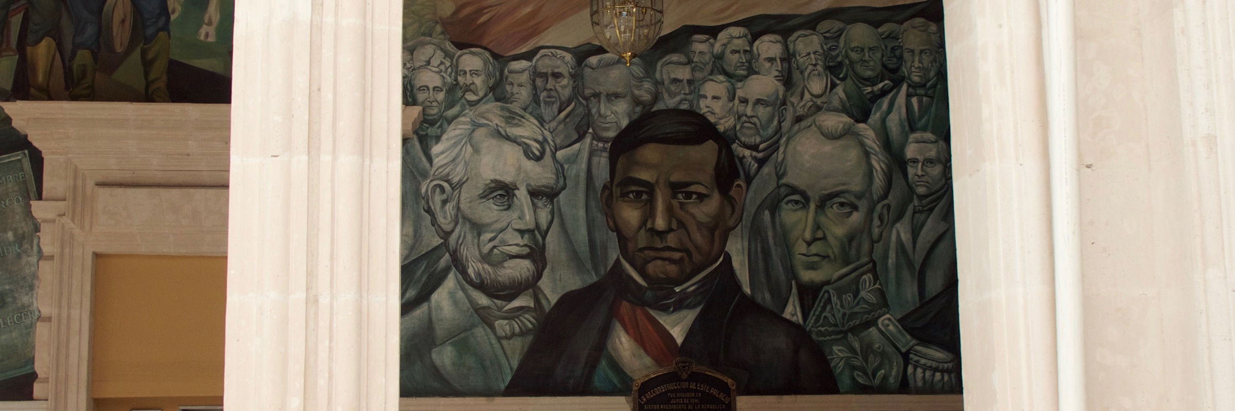 Historic mural at the Government Palace in Merida, Yucatan, Mexico, featuring portraits of key Mexican political figures. 