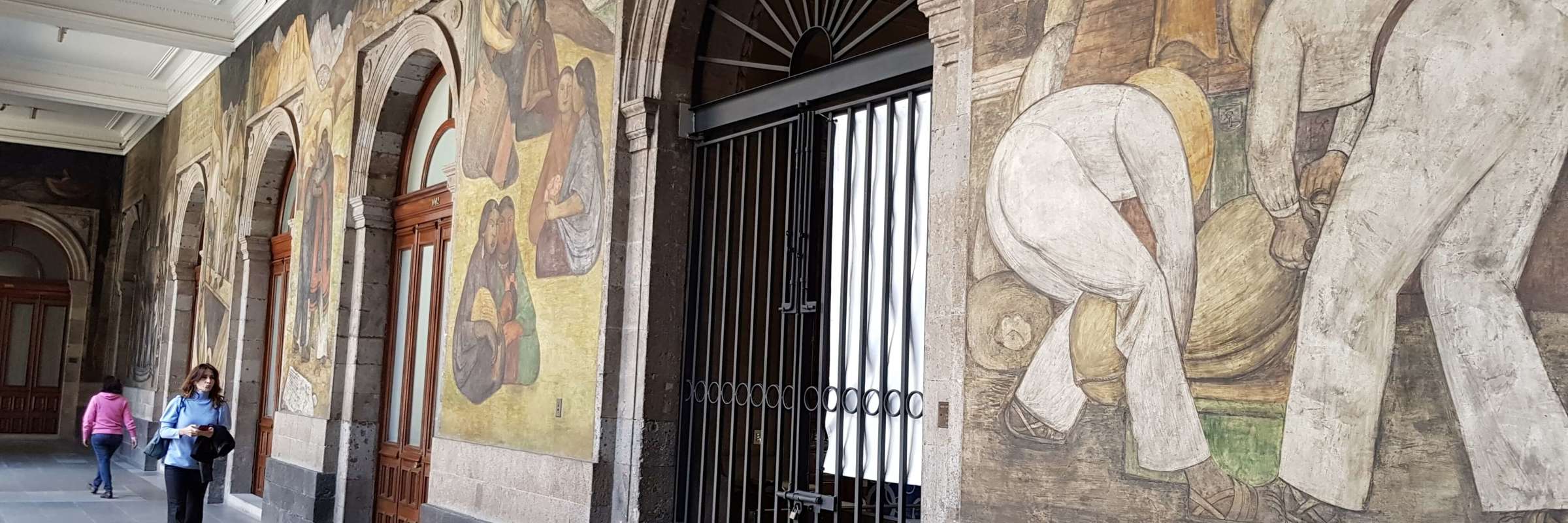 Famous Diego Rivera murals on the walls of the National Palace in Mexico City, depicting Mexican history and labor scenes. 