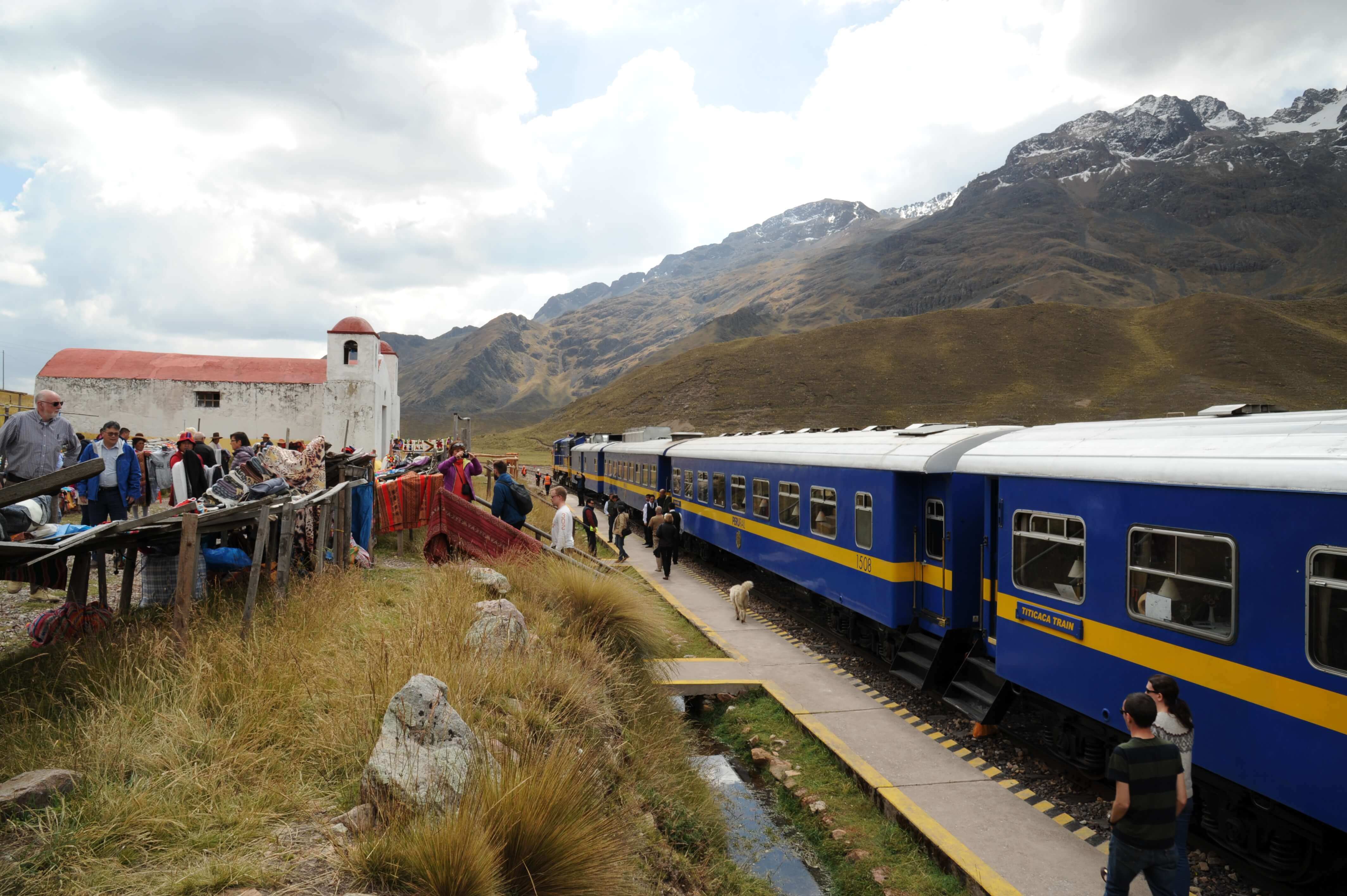 Passengers at La Raya Pass, a high-altitude stop on the Belmond Andean Explorer train route. 