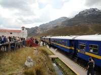 Passengers at La Raya Pass, a high-altitude stop on the Belmond Andean Explorer train route. 