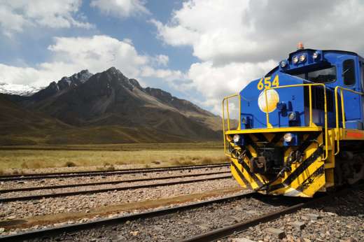 The Belmond Andean Explorer luxury train traveling through the Peruvian Andes- South America's most iconic rail journey. 