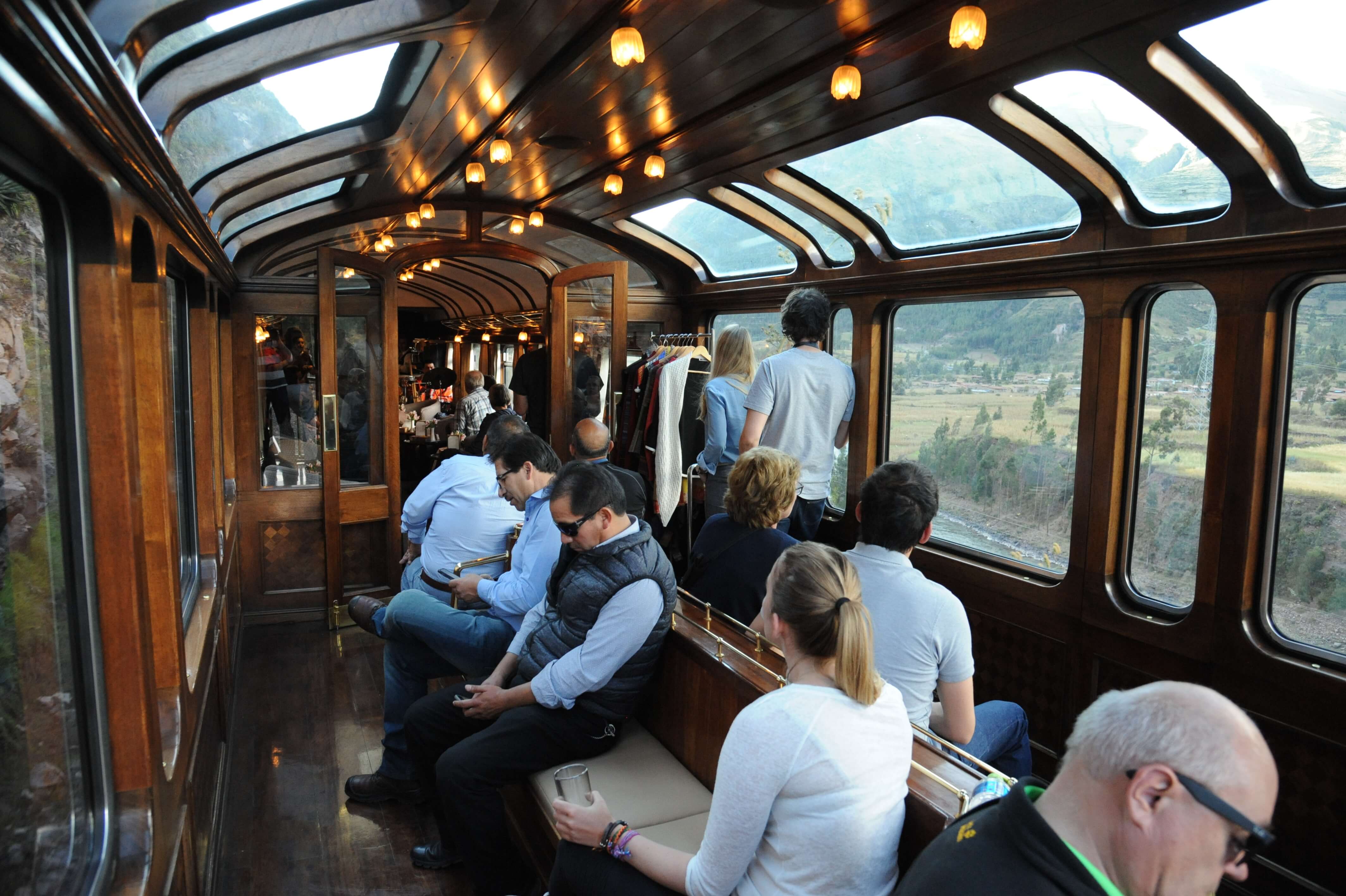 Guests enjoying the panoramic observation lounge aboard the Belmond Andean Explorer train. 
