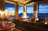 South America - Peru, stylish interior lounge of Titilaka Lodge overlooking Lake Titicaca. 