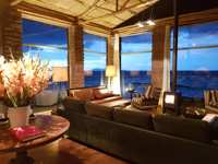South America - Peru, stylish interior lounge of Titilaka Lodge overlooking Lake Titicaca. 