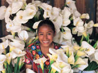 Smiling face framed by typical local flower