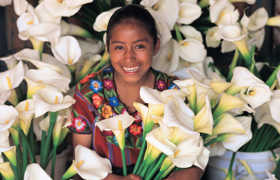 Smiling face framed by typical local flower