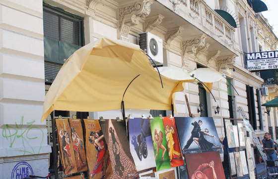 Colorful paintings displayed at Buenos Aires street market in Argentina.