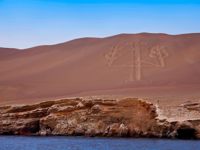 The Paracas Candelabra geoglyph etched into a coastal hillside near the Ballestas Islands, Peru. 