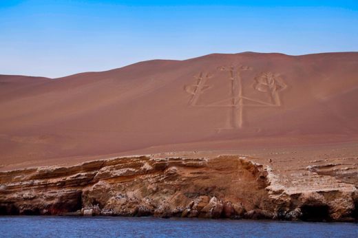 The Paracas Candelabra geoglyph etched into a coastal hillside near the Ballestas Islands, Peru. 