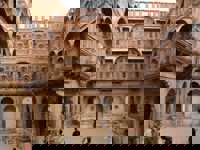 Asia-India - Tourists explore the intricate inner courtyard of Mehrangarh Fort in Jodhpur. 
