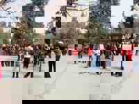 China- Seniors dancing in a Beijing park with live music, a vibrant scene of leisure and local community. 
