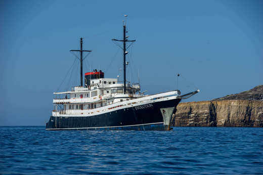 The Evolution sailing past Isabela Island