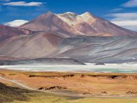 Multicolored mountains and salt flats in the Chilean Altiplano near San Pedro de Atacama. 
