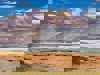 Multicolored mountains and salt flats in the Chilean Altiplano near San Pedro de Atacama. 
