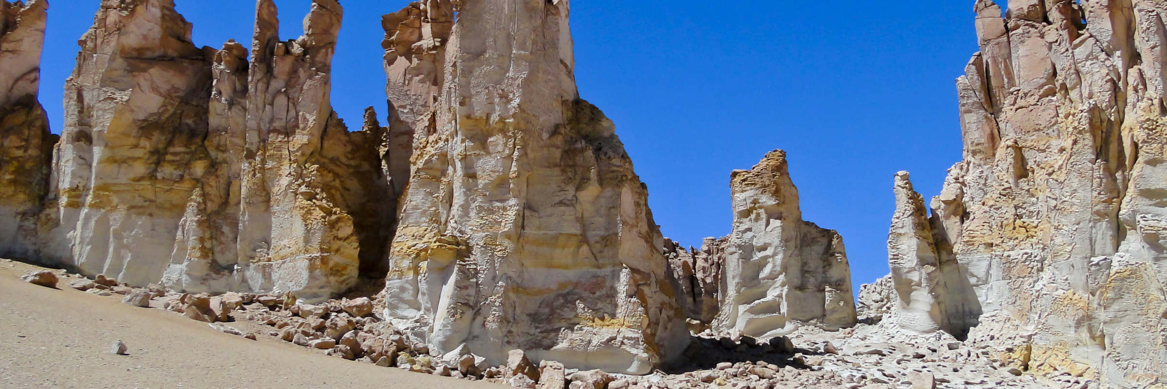 Towering sandstone formations rise from the desert floor in Chile's Atacama highlands. 