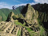 South America - Peru, aerial view of Machu Picchu with a hot air balloon above the Inca citadel. 
