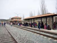 Passengers waiting at the Chepe train station in Copper Canyon, Mexico, ready for the scenic rail journey through the canyon. 