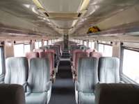 Interior view of the Chepe Train with rows of seats, taking passengers through Mexico's Copper Canyon. 
