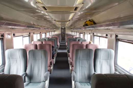 Interior view of the Chepe Train with rows of seats, taking passengers through Mexico's Copper Canyon. 