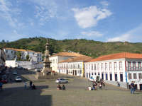 Tiradentes Square in Ouro Preto, Brazil, with colonial buildings and the monument to Joaquim Jose da Silva Xavier. 