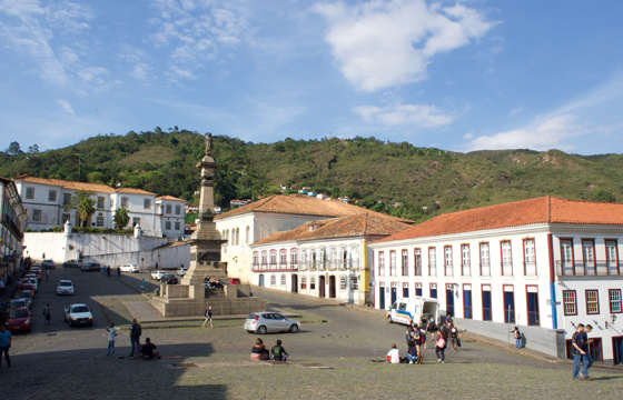 Tiradentes Square in Ouro Preto, Brazil, with colonial buildings and the monument to Joaquim Jose da Silva Xavier. 