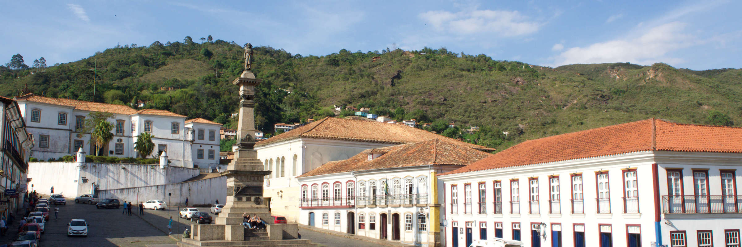 Tiradentes Square in Ouro Preto, Brazil, with colonial buildings and the monument to Joaquim Jose da Silva Xavier. 