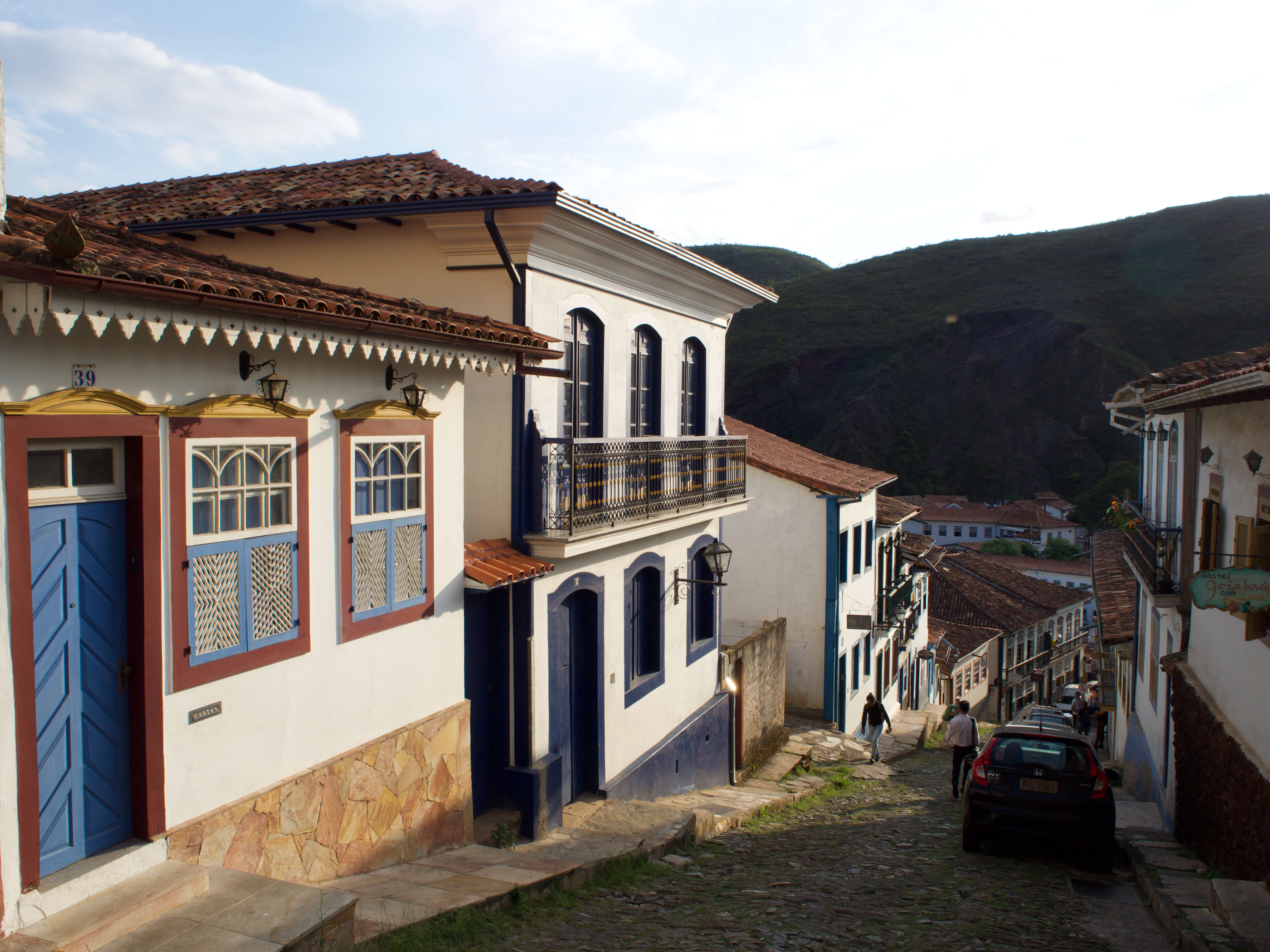 Charming cobbled street with colourful colonial houses in Ouro Preto, Minas Gerais, Brazil. 