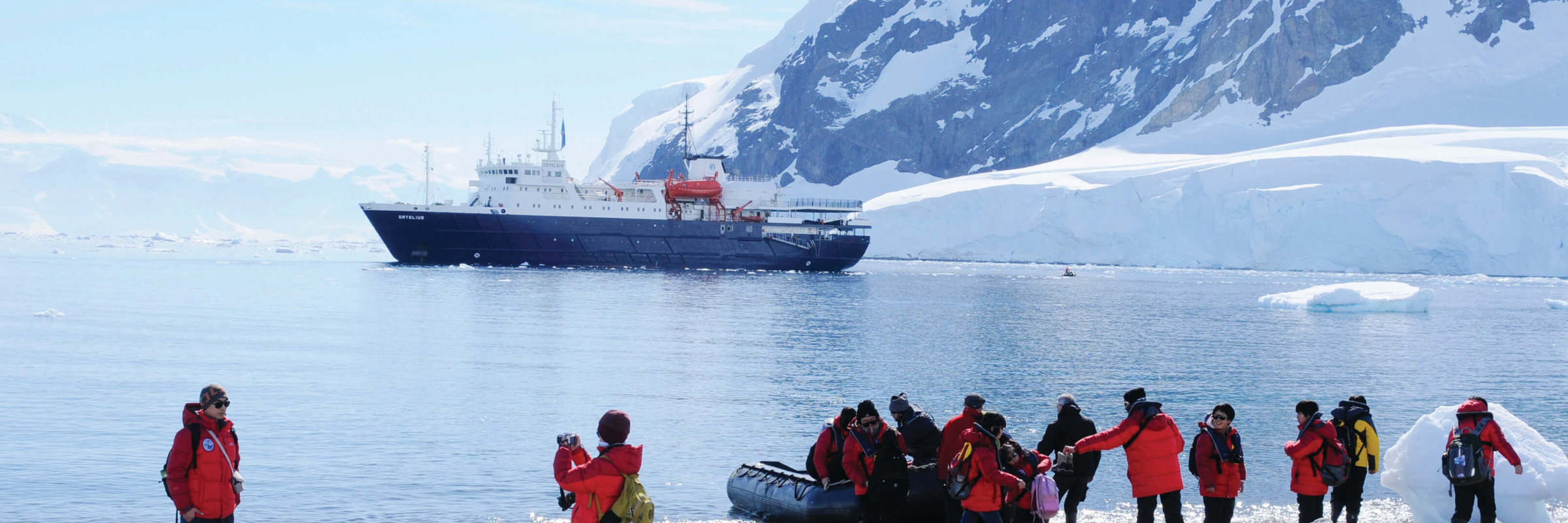 Plancius In Antarctica With People On Zodiac Landing