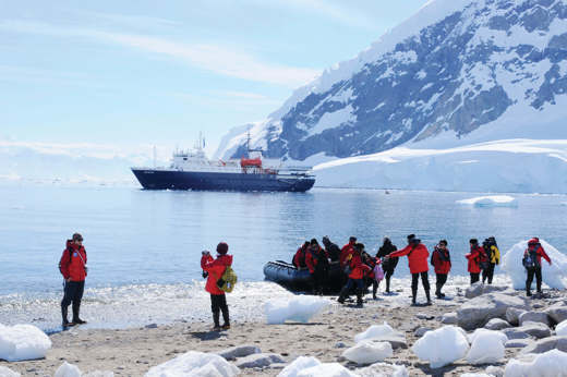 Plancius In Antarctica With People On Zodiac Landing
