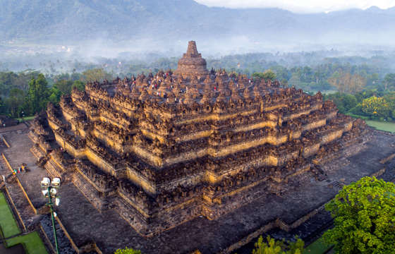Borobudur Temple rises from the mist in Magelang, Central Java, Indonesia. 