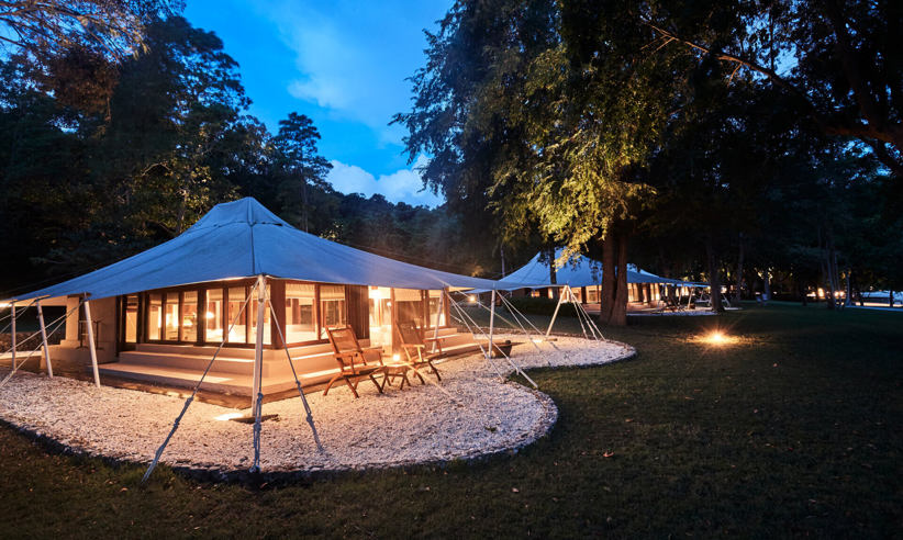 A luxury tent at dusk