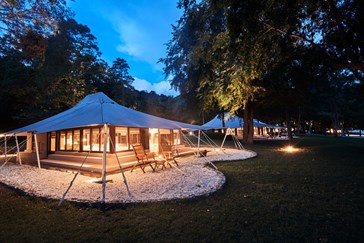 A luxury tent at dusk