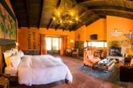 Warm Andean decor and rustic elegance define this cozy suite at Sol y Luna in the Sacred Valley. 