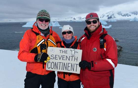 Expedition guests celebrate reaching Antarctica, the world's seventh continent. 