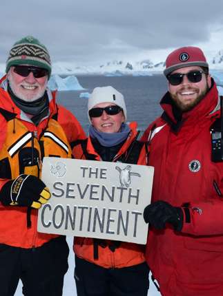 Expedition guests celebrate reaching Antarctica, the world's seventh continent. 