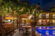 Enjoy a drink at the bar by the pool