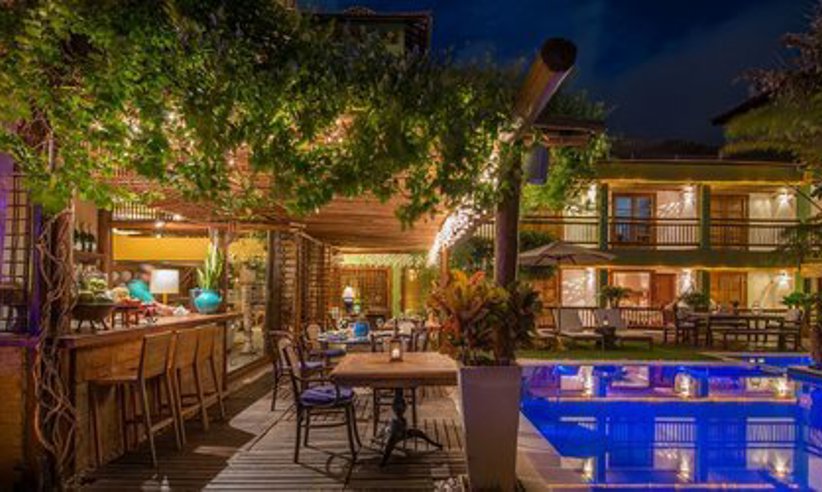 Enjoy a drink at the bar by the pool