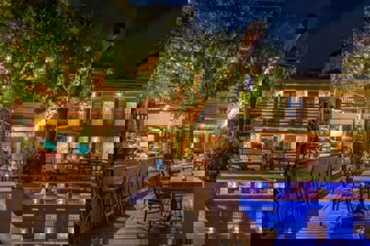 Enjoy a drink at the bar by the pool