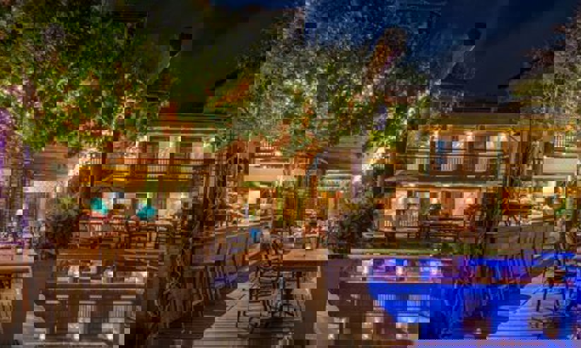 Enjoy a drink at the bar by the pool