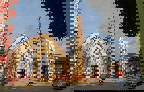 A strikingly modern church rises beside Cajamarca's main plaza under the Andean sky. 