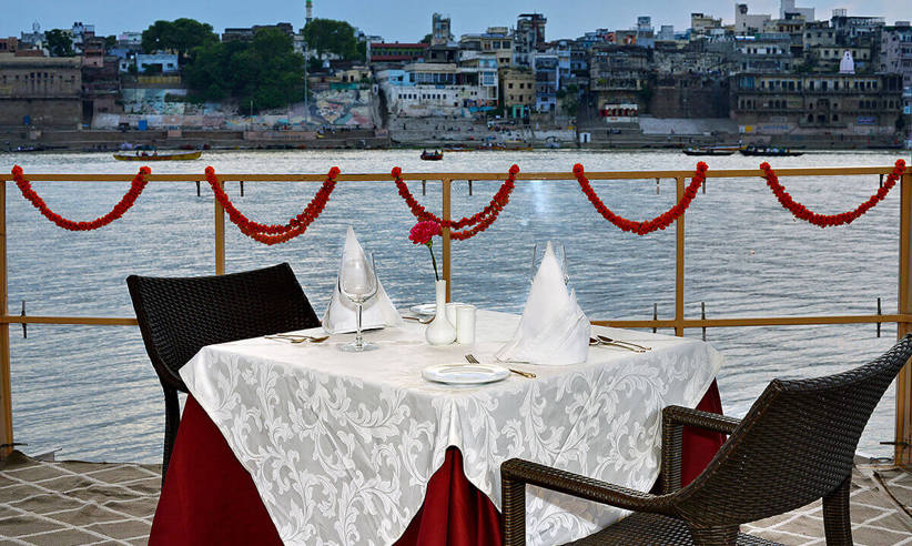 Dine on a terrace overlooking the sacred Ganges 