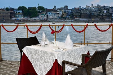 Dine on a terrace overlooking the sacred Ganges 