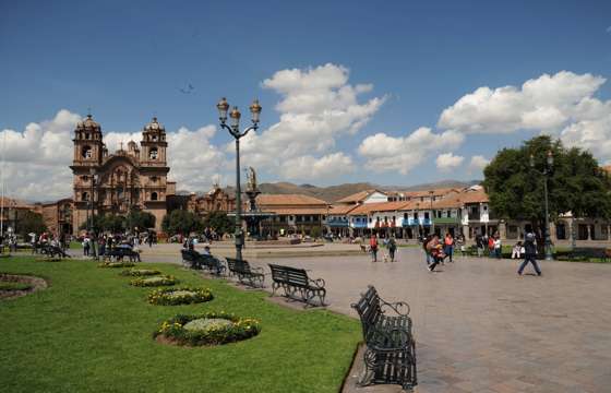 Cusco's vibrant Plaza de Armas bustles with charm beneath Andean skies and colonial spires. 