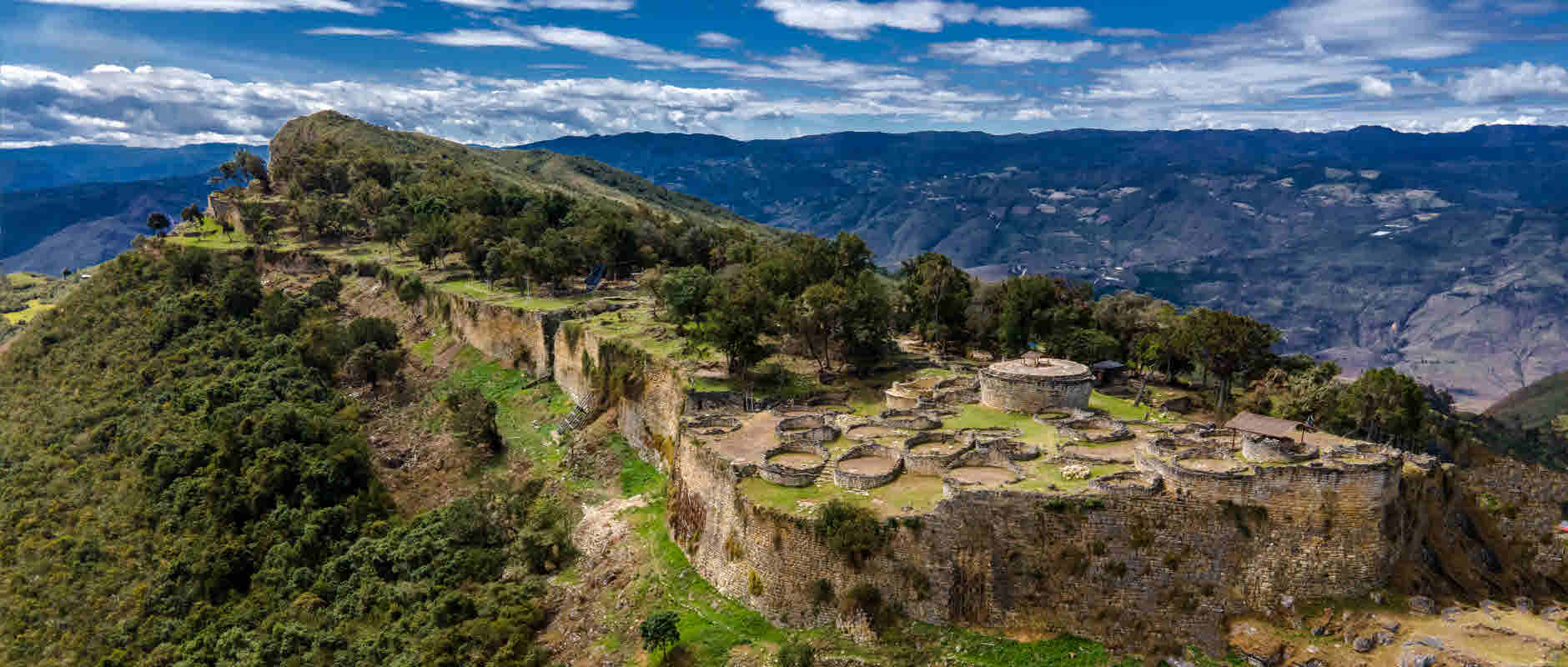 The hilltop stone fortress of Kuelap, built by the Chachapoya people, overlooks the Andean mountains of northern Peru. 